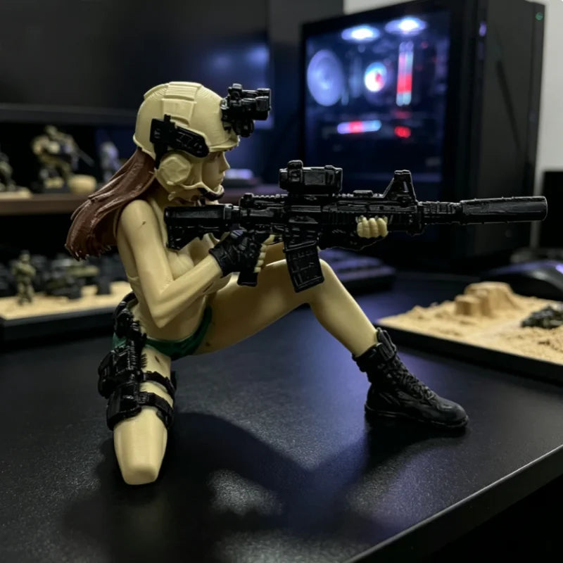 A female tactical rifleman desktop figurine in a helmet and armor posing with a black assault rifle.