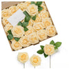 A box filled with lifelike foam roses in pale yellow and green leaves for wedding and home décor.