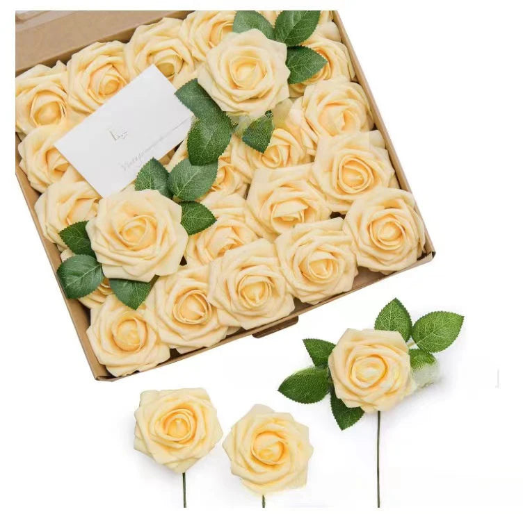A box filled with lifelike foam roses in pale yellow and green leaves for wedding and home décor.