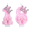 Two pink glitter crown shaped birthday candles for cake toppers