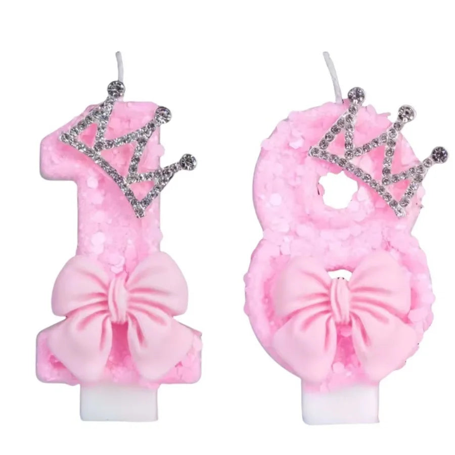 Two pink glitter crown shaped birthday candles for cake toppers