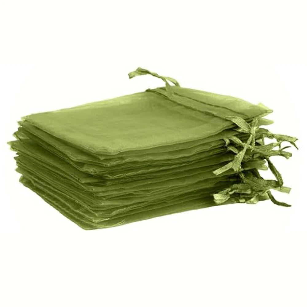 A stack of olive green drawstring organza bags for gifts or decorations.