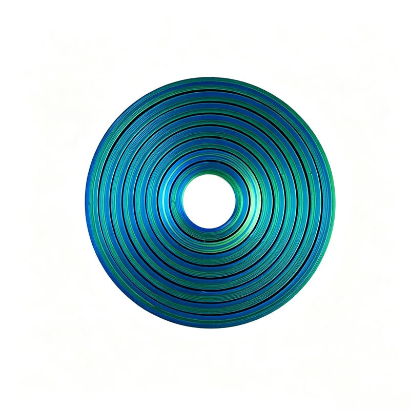 A close-up view of a rotating ball spinner fidget toy with a vibrant blue and teal color pattern.