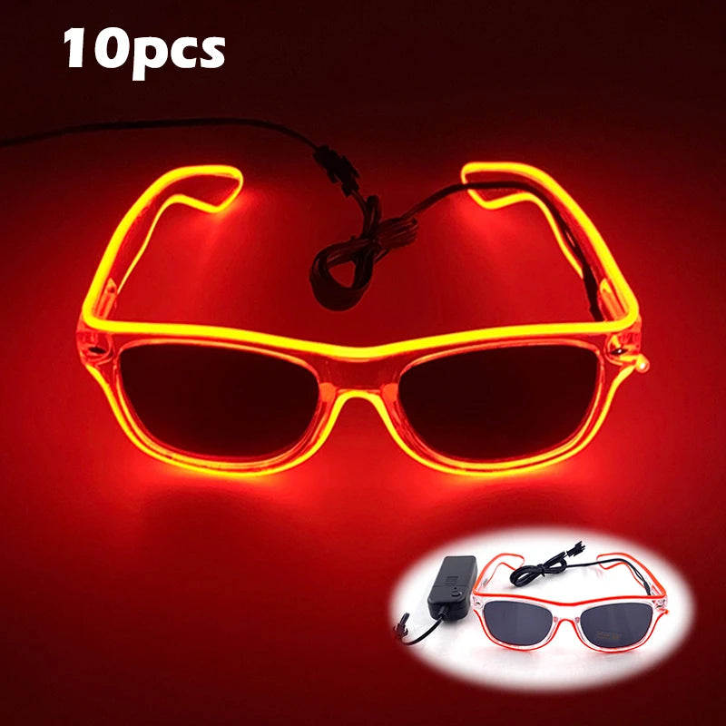A pair of neon orange LED wire party glasses glowing brightly against a dark red background.