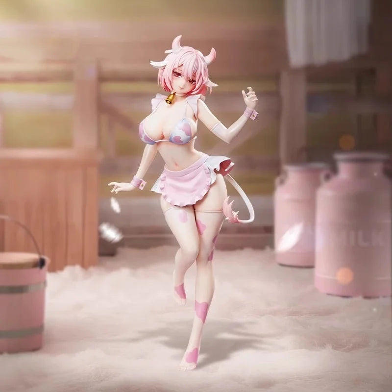 A pink cow-girl miniature figure with horns and a ruffled skirt stands in a soft, light setting.