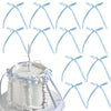 A set of twenty light blue bowknot ribbon cake toppers displayed against a white cake.