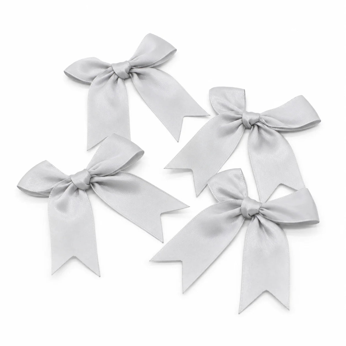 A set of elegant light gray satin ribbon bows for gifts and DIY crafts