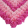 A heart shape made of pink and magenta artificial foam rose decorations.