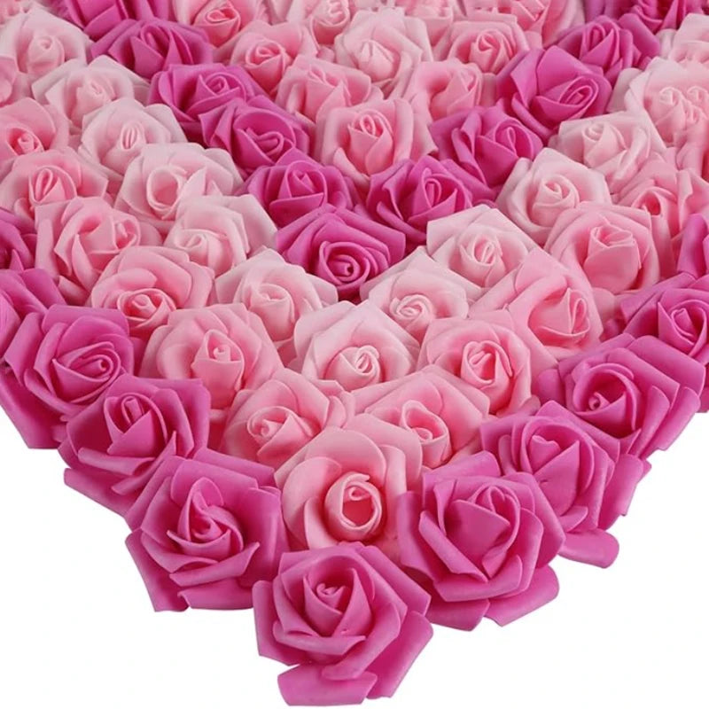 A heart shape made of pink and magenta artificial foam rose decorations.