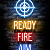 Neon alphabet gamepad target sight ready fire aim glowing on a dark brick wall