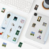 A collection of aesthetic acidic dreamcore graffiti stickers displayed on a white desk next to a laptop and a smartphone.