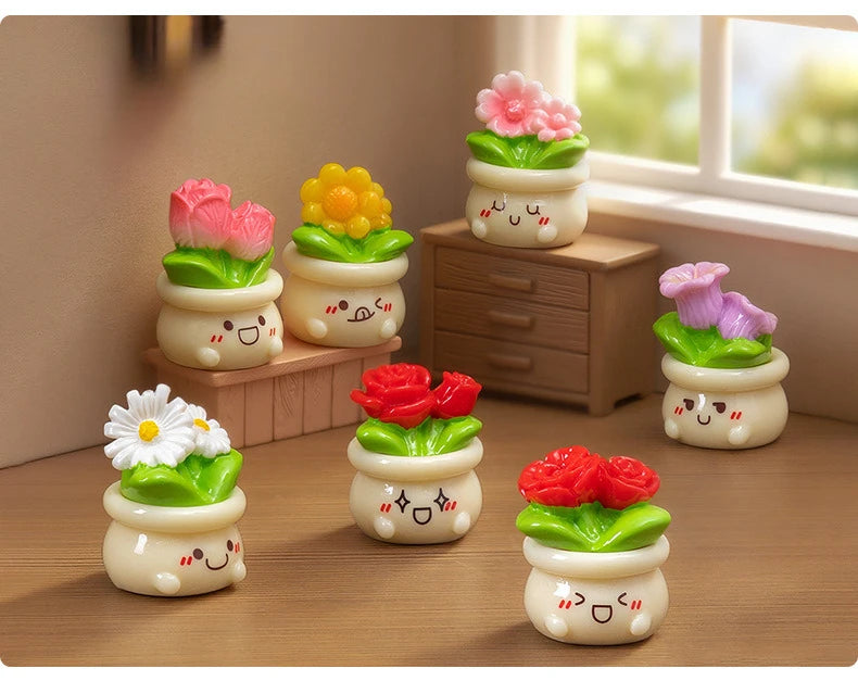 A collection of small potted rose resin charms in various colors like pink, yellow, and purple displayed on a wooden surface.
