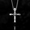A silver stainless steel cross necklace pendant with a textured design against a black background.