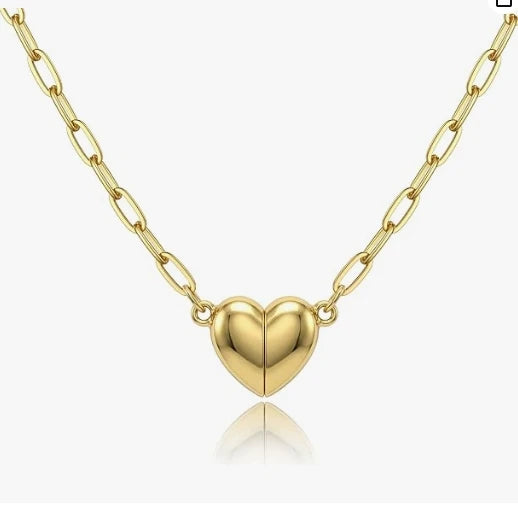A delicate gold plated heart pendant necklace with a chain and magnetic clasp.