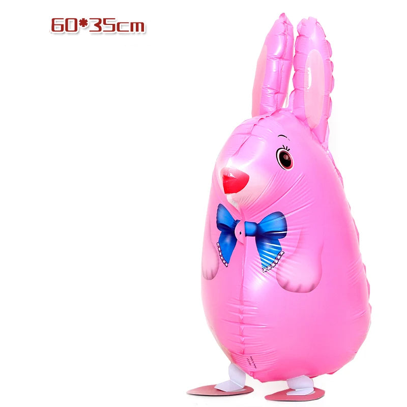 Pink foil balloon shaped like a rabbit with a blue bow for birthday party decor