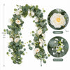 Artificial eucalyptus and rose garland featuring white flowers and greenery.