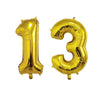 Gold foil number balloons forming the number 13 for birthday party decor