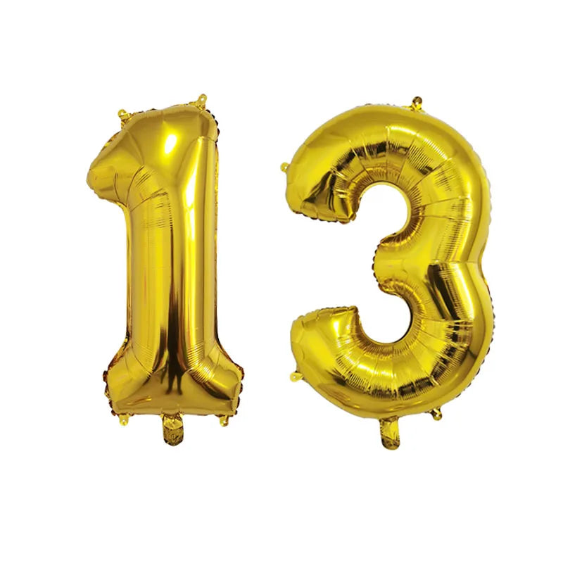 Gold foil number balloons forming the number 13 for birthday party decor