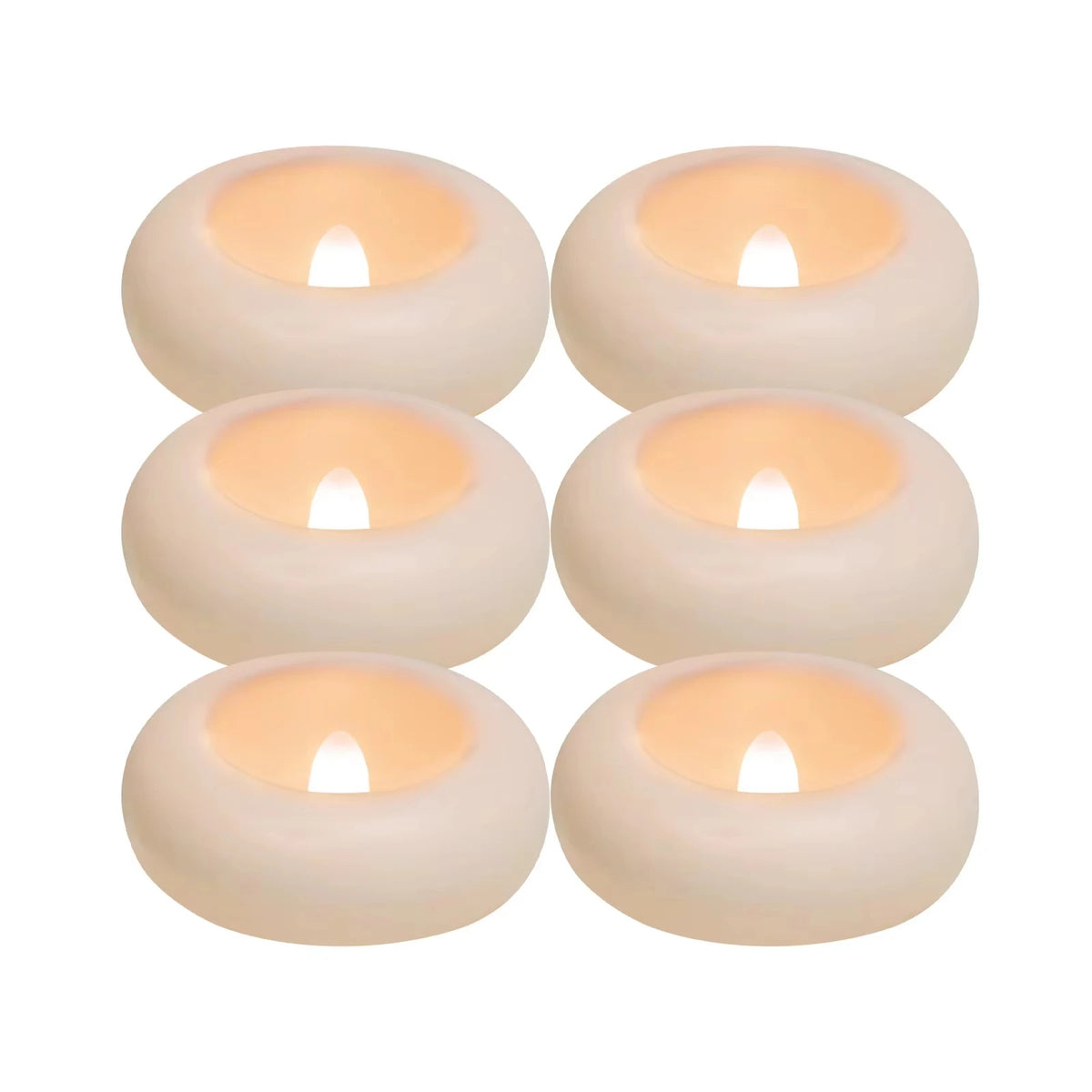 Four round waterproof floating LED candles with a warm white glow
