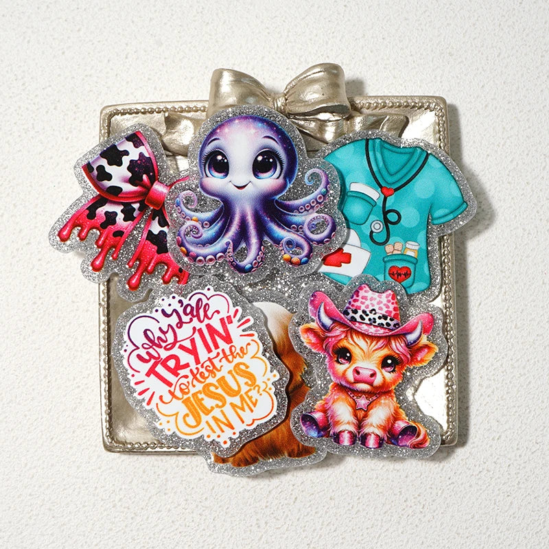 Silver glitter acrylic charms featuring a purple alien, a blue shirt, and a puppy face.