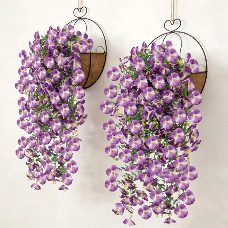 Artificial eucalyptus and violet pansy hanging vine in black wire hangers