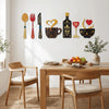 A set of rustic wood floral kitchen decor featuring various silhouette shapes in gold, black, and red on a white wall.