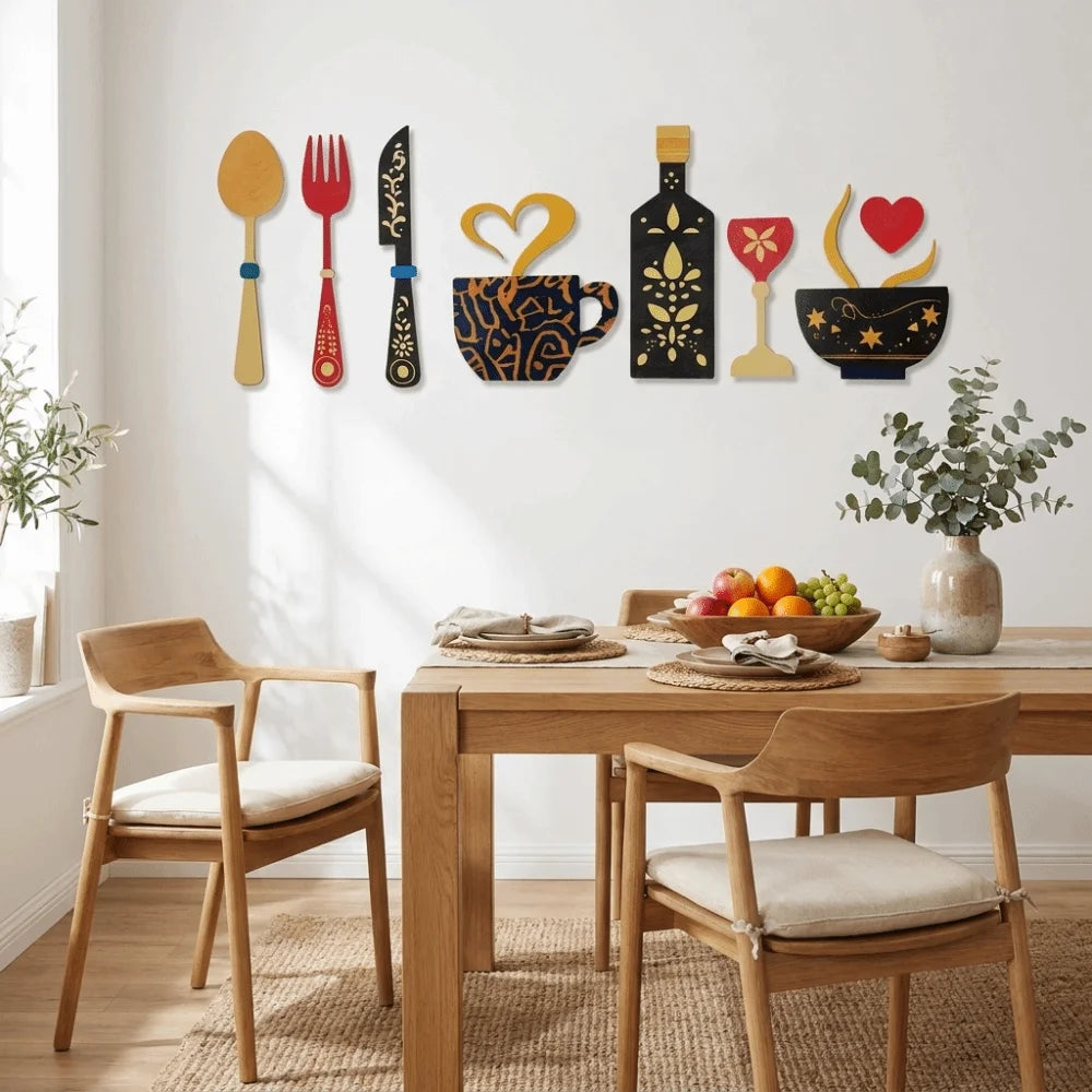 A set of rustic wood floral kitchen decor featuring various silhouette shapes in gold, black, and red on a white wall.