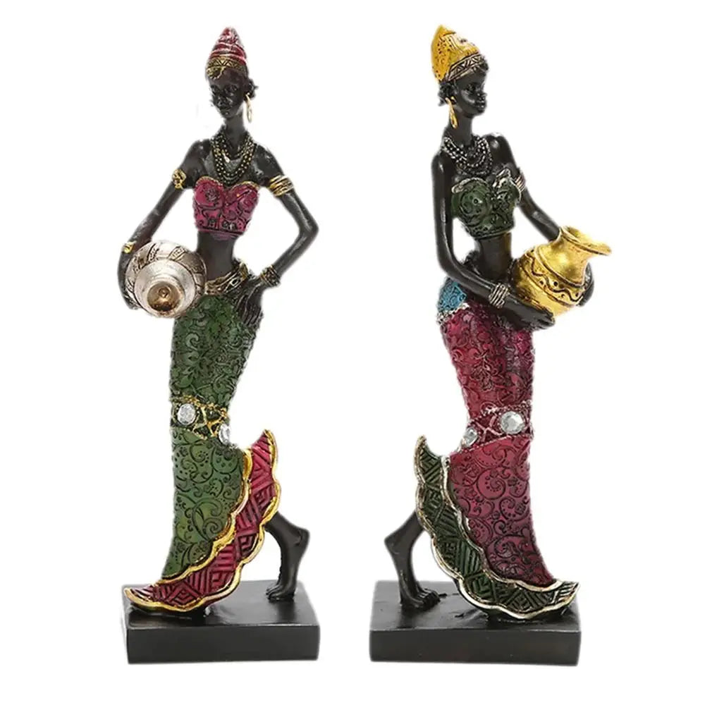 Hand-painted resin statue of an African tribal lady with gold jewelry and traditional attire.