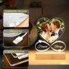 A custom acrylic heart photo frame featuring a couple, showcasing protective film, USB power port, and rounded corners.