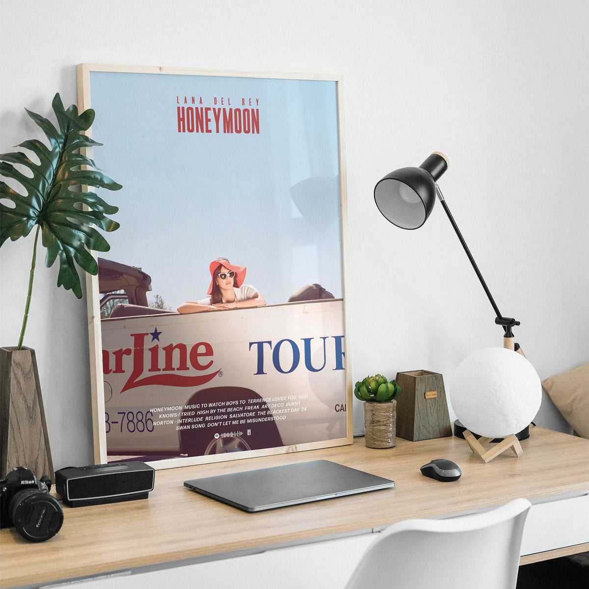 A framed canvas print featuring Lana Del Rey and the words Honeymoon and Tour