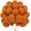 A bunch of round orange latex balloons tied together with thin gold strings.