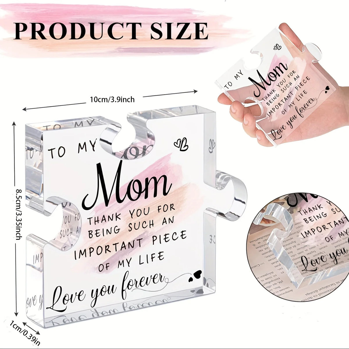 A clear acrylic puzzle-shaped plaque with engraved text for a mother, shown next to a hand.
