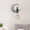 Black cat silhouette inside a crescent moon outline wall decor sculpture
