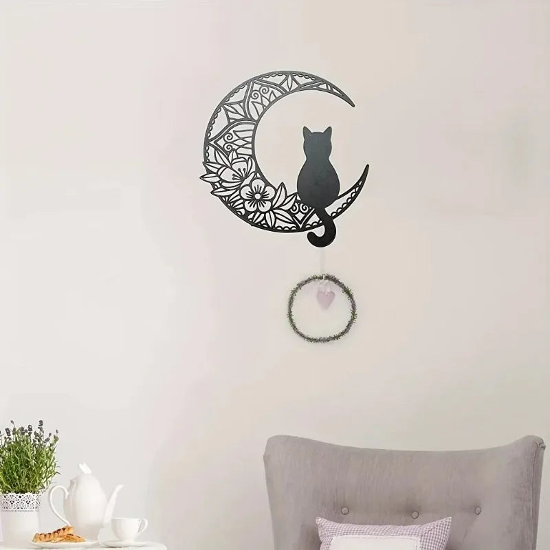 Black cat silhouette inside a crescent moon outline wall decor sculpture