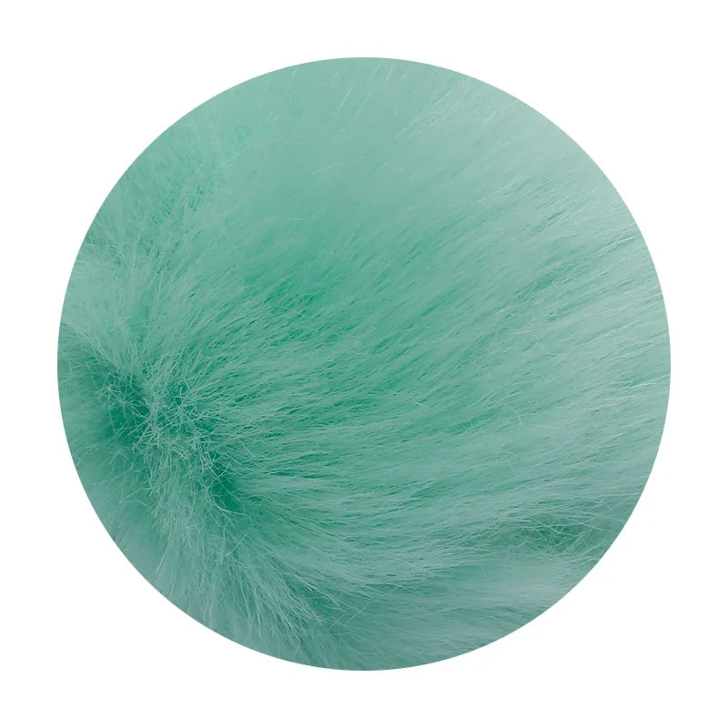 A spherical pom pom made of light teal faux fur with a silver chain.