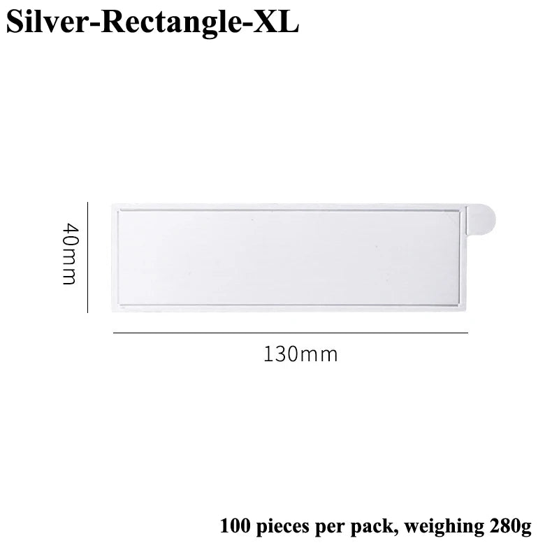 Silver Rectangle XL dessert cake board, 40mm high and 130mm long, sold in a 100-piece pack.