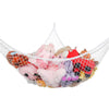 A mesh storage organizer hammock filled with various stuffed animals and toys.