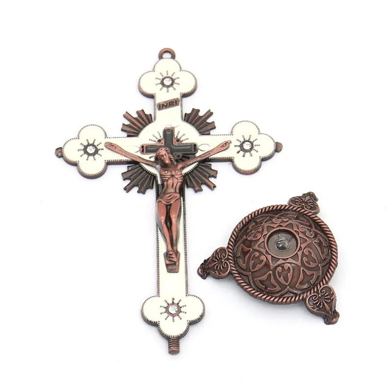 Antique-style crucifix figurine with a cross and a decorative stand.