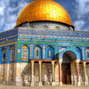 A golden dome mosque structure with blue and white tilework under a cloudy sky.