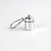 Silver mini waterproof pill organizer keychain with a metal keyring