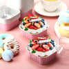 Pink reusable aluminum foil baking cups filled with fresh fruit and cream