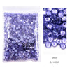 Bag of violet glass rhinestones with various crystal sizes and shapes