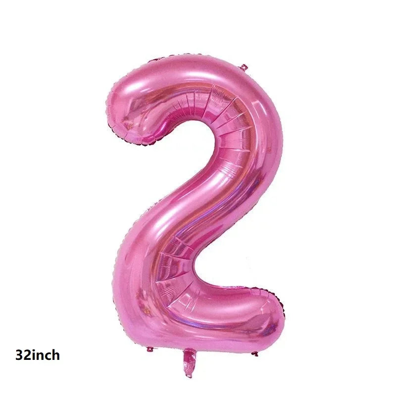 A pink, curved latex balloon shaped like the number two for party decorations.