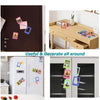 Magnetic mini photo frames for Instax and Polaroids displayed on a wooden table and refrigerator doors.