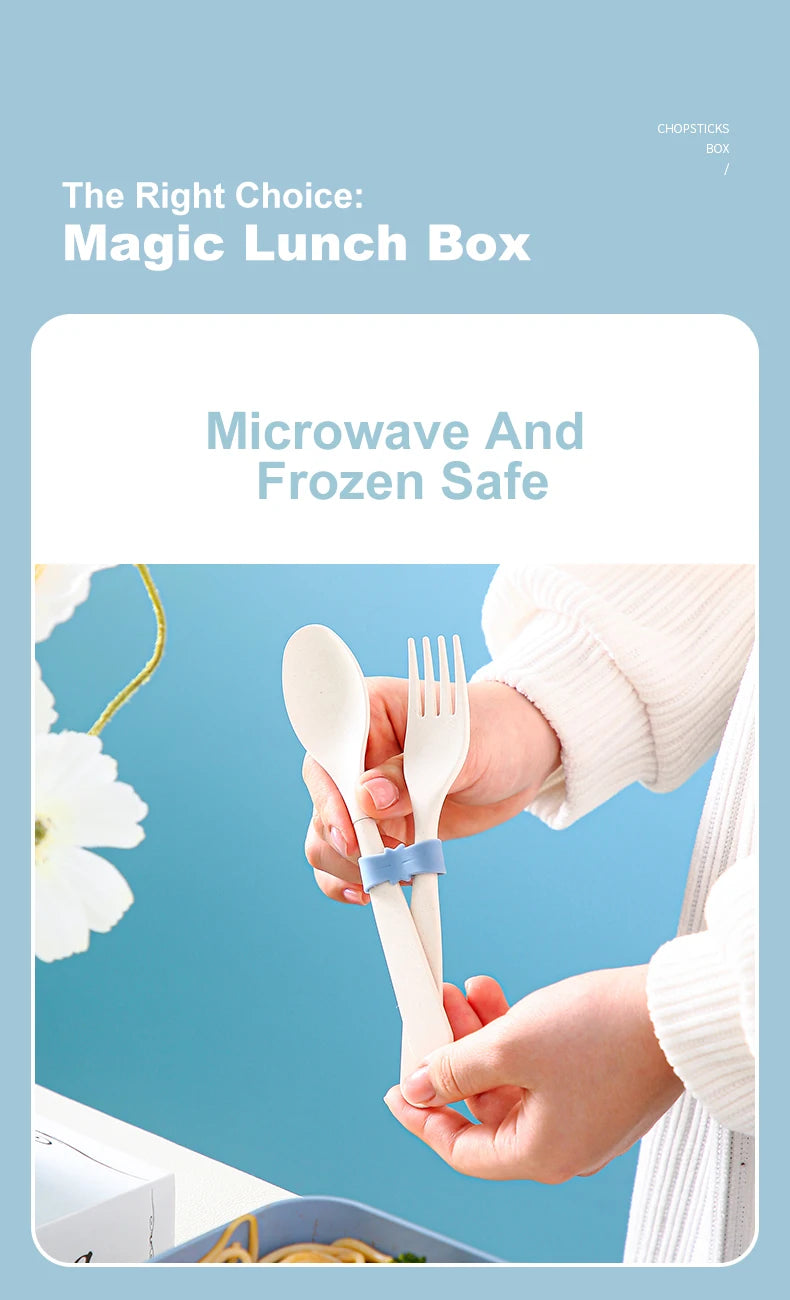 A person is holding a light wood bamboo fork and spoon inside an open lunch box, demonstrating the Magic Lunch Box.