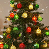 A decorated Christmas tree adorned with various colored ornaments and fairy lights.
