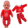 A red Christmas outfit set for dolls featuring a long-sleeved top and matching pants with festive designs.