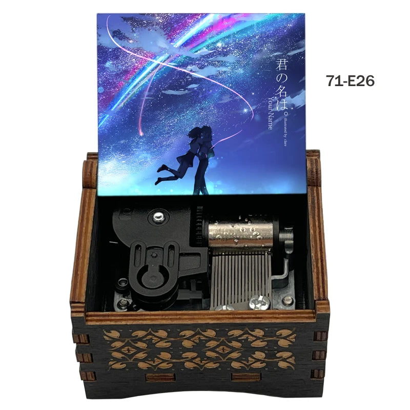 Adorno de caja musical de madera con ilustración de un cielo estrellado y texto japonés.