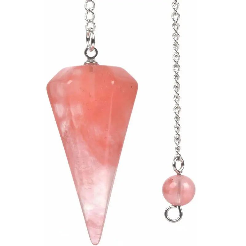 A pink quartz point pendant on a silver chain for divination and energy healing