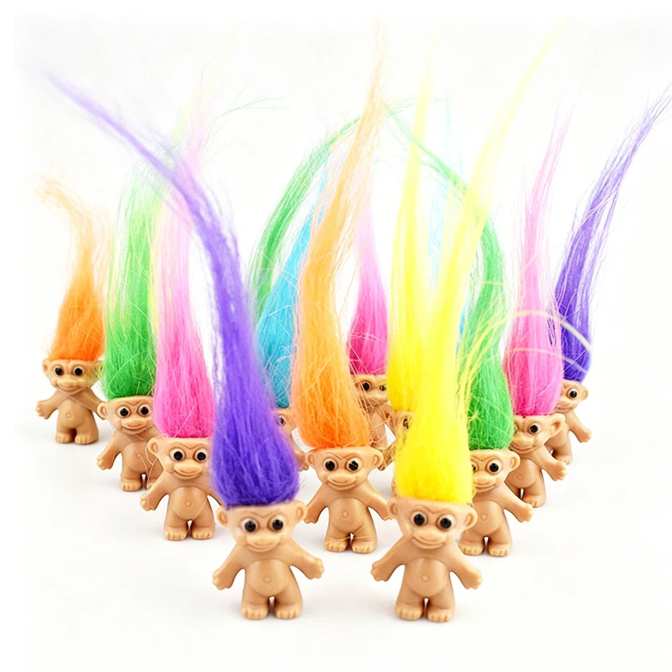 A collection of mini retro troll doll figures with brightly colored, flowing hair strands.